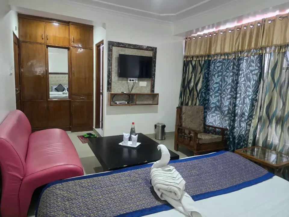 Family suite with a wardrobe and wall-mounted TV