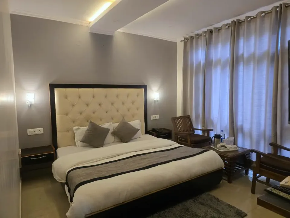 Premium room in daylight with a tea and coffee tray on a wooden table by the window